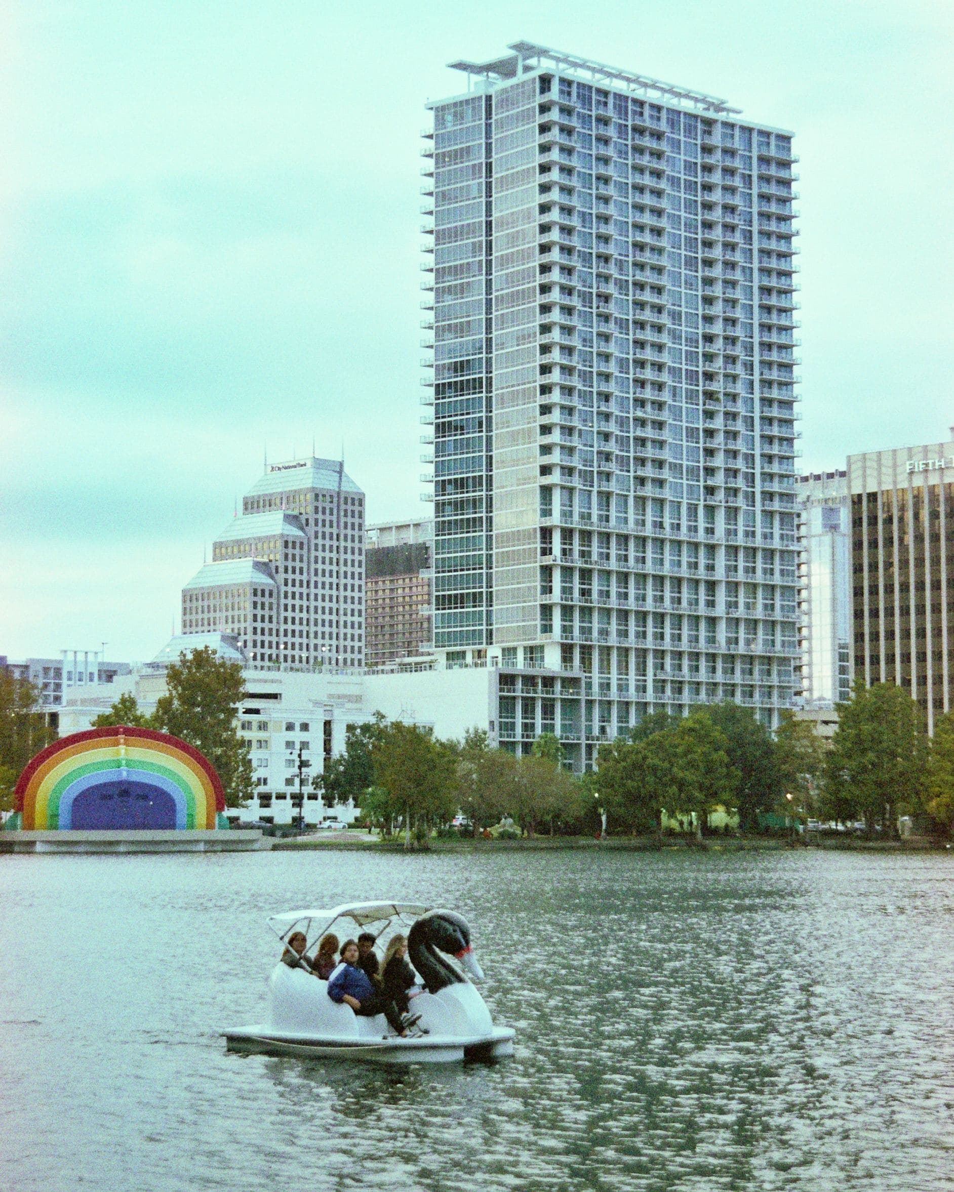 Lake Eola Park in downtown Orlando, Florida with swan boats — real estate investment opportunities